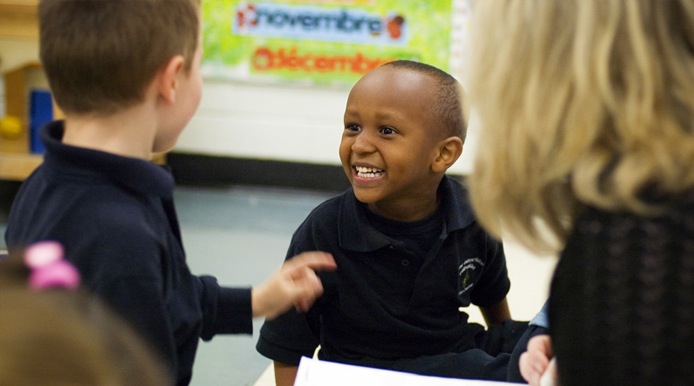 Student smiling to another student