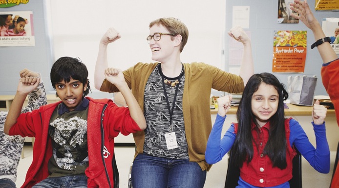 3 people cheering